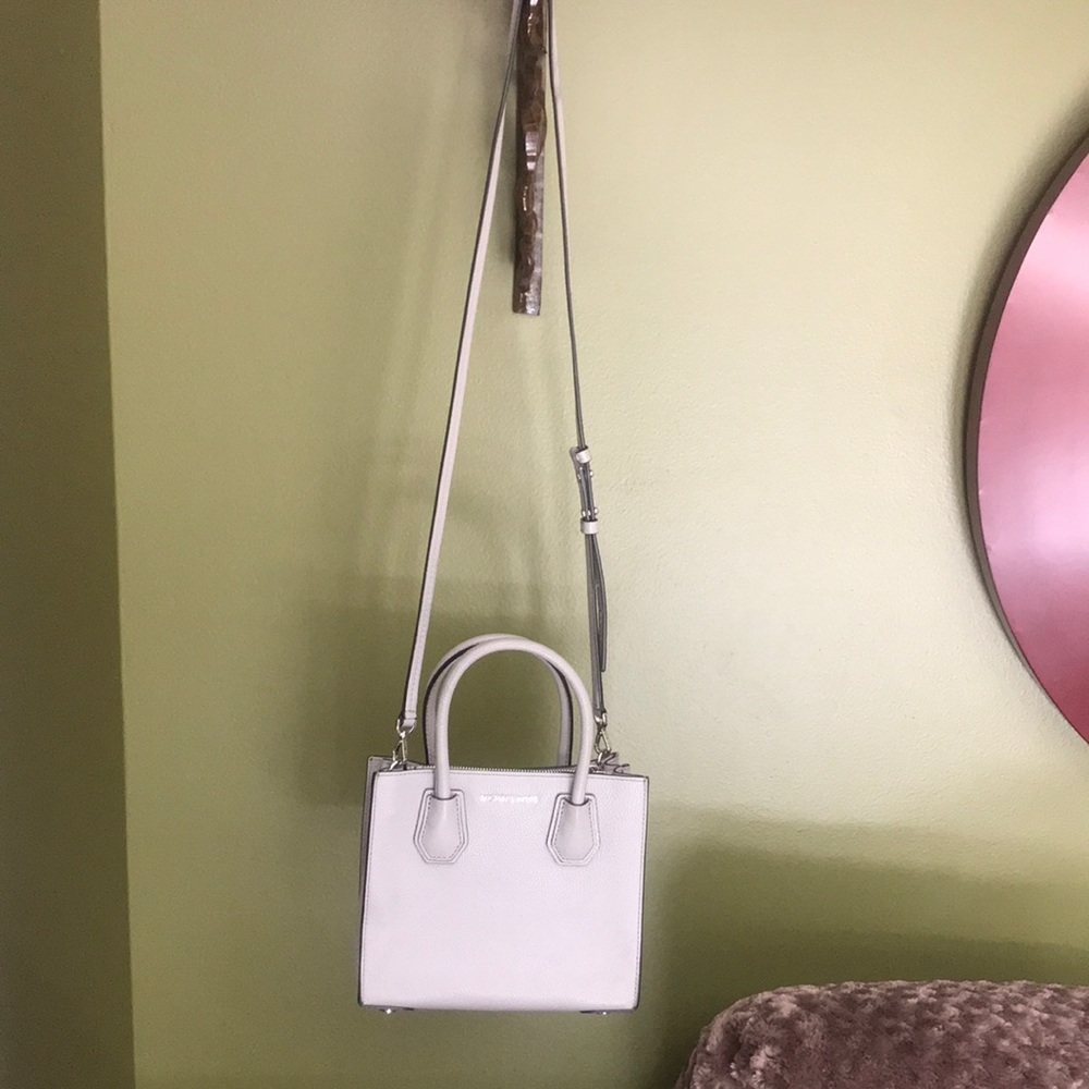 Brand new Michael Kors purse. Comes with cleaner.